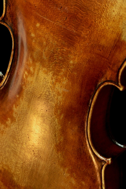 Back of an old viola with slightly worn finish