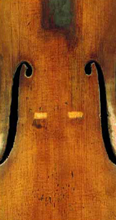 Same violin top after repair; no trace of the cracks remain in the spruce top